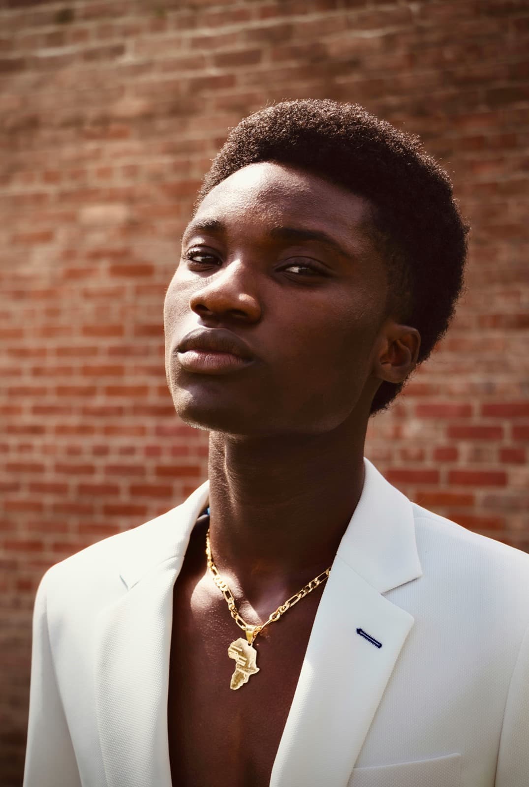 Portrait against brick wall